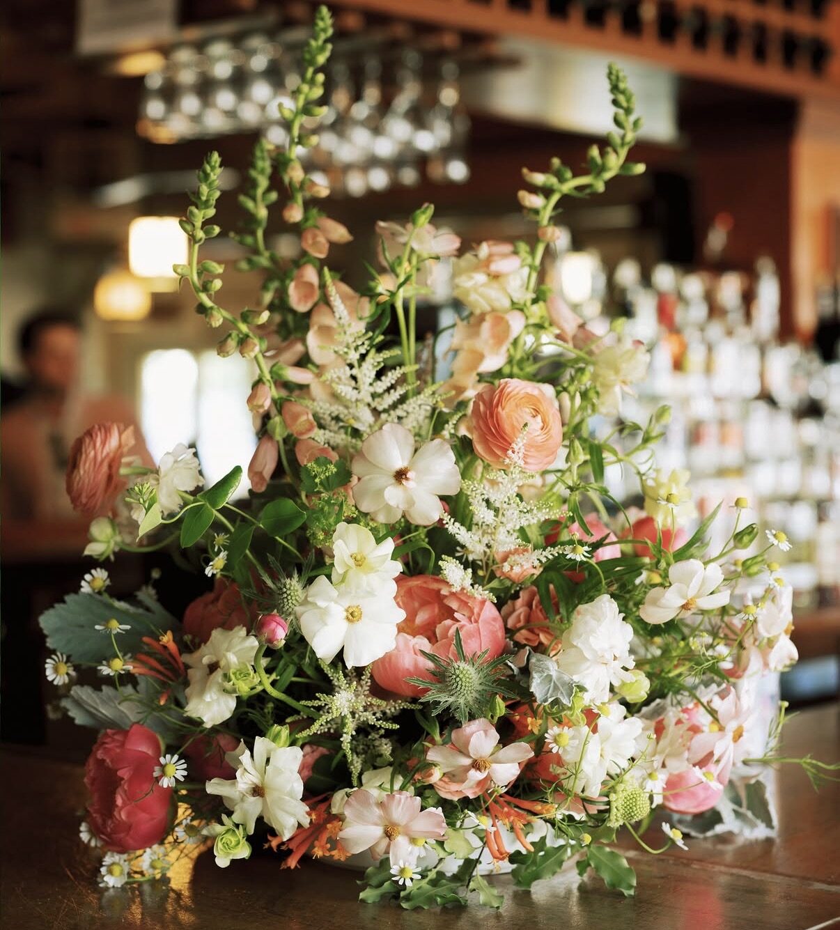 Fresh floral arrangement at the bar