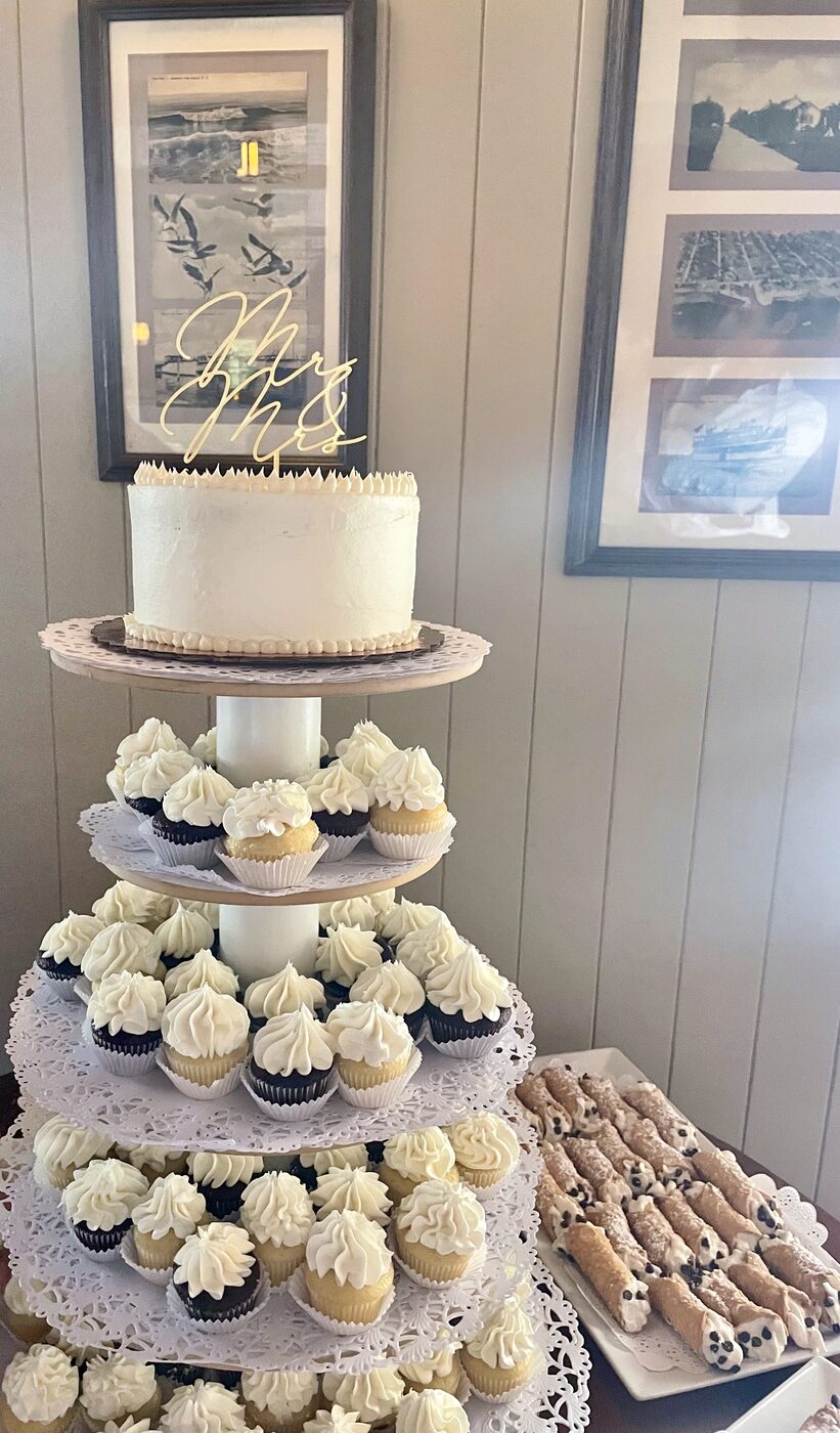 Wedding cake and cupcake tower with Mr & Mrs topper, and cannoli tray